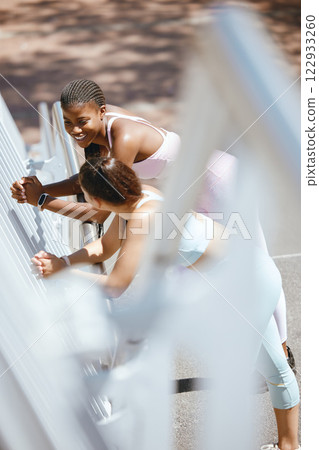 Fitness, girl friends and talking on break outside after sports, workout and healthy lifestyle training. Happy, smiling and cheerful black women having a conversation on friendship or sport Fitness, girl friends and talking on break outside after sports, workout and healthy lifestyle training. Happy, smiling and cheerful black women having a conversation on friendship or sport 122933260