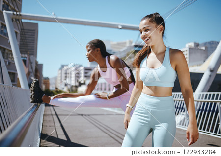 Fitness, stretching and friends women doing workout training together outdoor on urban city bridge, happy with health lifestyle. Young diversity sports or athlete people exercise for motivation goal 122933284
