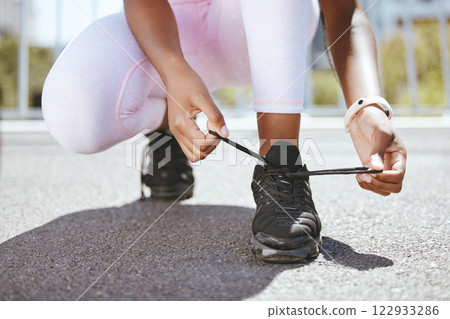 Tie shoes, marathon running and woman start training workout, exercise and sports fitness in outdoor urban city. Closeup athlete feet, runner foot sneakers and ready for cardio challenge performance 122933286