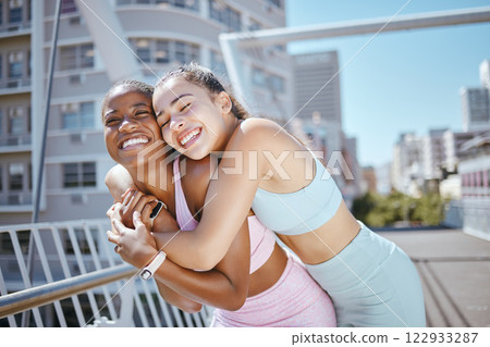 Fitness, city and hug from woman couple with exercise motivation, workout love and training wellness together in summer. Happy diversity sports friends or people exercise support or healthy lifestyle 122933287