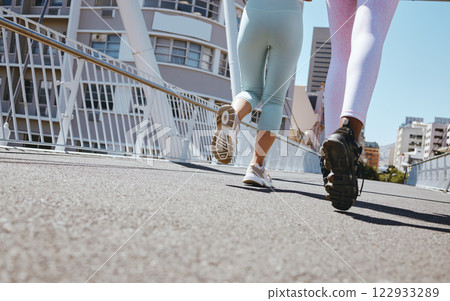 Women workout in city, fitness legs running shoes and step marathon motivation on Miami street. Friends training together in summer, outdoor urban road exercise and healthy strong cardio marathon 122933289