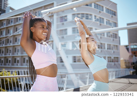 Friends, fitness and training together in the city on summer day. Workout, stretching and two young women exercising outside in urban town. Running, sports and wellness outdoors to be fit and active Friends, fitness and training together in the city on summer day. Workout, stretching and two young women exercising outside in urban town. Running, sports and wellness outdoors to be fit and active 122933341
