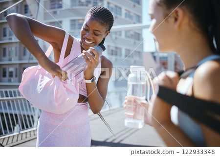 Fitness, workout and exercise with a black woman athlete outdoor in the city for training, yoga or wellness. Water, happy and urban with a young female sports woman outside in a town for exercising Fitness, workout and exercise with a black woman athlete outdoor in the city for training, yoga or wellness. Water, happy and urban with a young female sports woman outside in a town for exercising 122933348