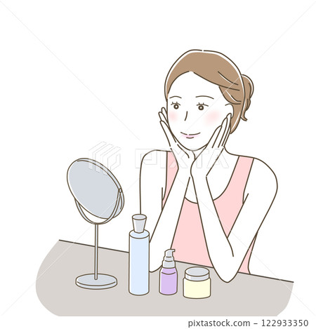 A woman happily doing skin care while looking at the mirror 122933350