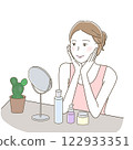 A woman happily doing skin care while looking at the mirror 122933351