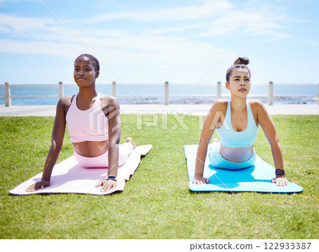 Fitness women, yoga stretching and cobra workout on outdoor grass in sun for mindset, wellness and strong body. Calm, focus and healthy friends balance in pilates exercise, training and zen sports Fitness women, yoga stretching and cobra workout on outdoor grass in sun for mindset, wellness and strong body. Calm, focus and healthy friends balance in pilates exercise, training and zen sports 122933387