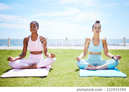 Women yoga meditation, peace and mudra hands in lotus pose for nature exercise, workout and zen energy outdoor grass. Calm, fitness and focus friends in lotus body for mindset, wellness and breathing 122933399