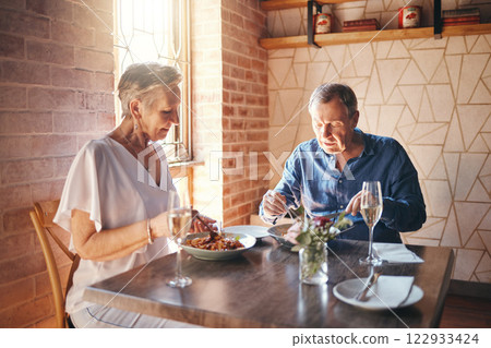 Food, date and senior couple eating at fine dining restaurant and having lunch together at a table. Elderly man and woman with dinner in marriage at cafe or coffee shop during retirement for love Food, date and senior couple eating at fine dining restaurant and having lunch together at a table. Elderly man and woman with dinner in marriage at cafe or coffee shop during retirement for love 122933424