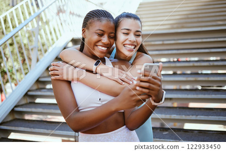 Selfie, phone and friends after exercise in a city, relax and bonding outdoors together. Fitness, diversity and cheerful women hug and enjoy freedom and fun while taking break from cardio run in town Selfie, phone and friends after exercise in a city, relax and bonding outdoors together. Fitness, diversity and cheerful women hug and enjoy freedom and fun while taking break from cardio run in town 122933450