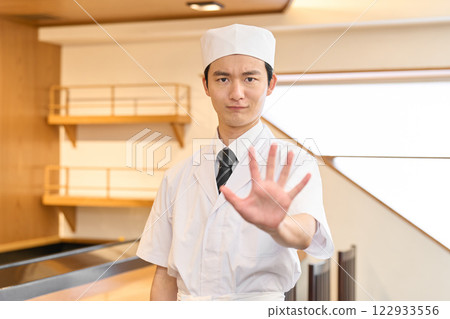 A restraining Japanese chef 122933556