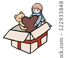 A girl and a bear appear from a gift box holding heart-shaped chocolates 122933848