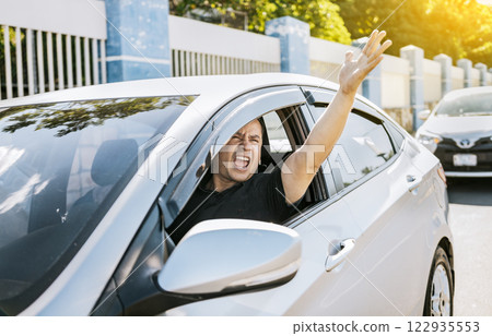 Angry driver yelling at another driver. Driver man yelling at driver while driving, Impatient driver yelling. Shouting impatient driver concept Angry driver yelling at another driver. Driver man yelling at driver while driving, Impatient driver yelling. Shouting impatient driver concept 122935553