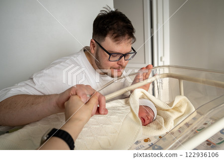 Father Adoring His Newborn Baby in Hospital 122936106