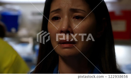 Sad Female Doctor Crying in Hospital Sad Female Doctor Crying in Hospital 122938656
