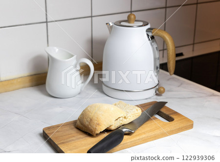 Breakfast served on the kitchen table with fresh bread and coffee 122939306