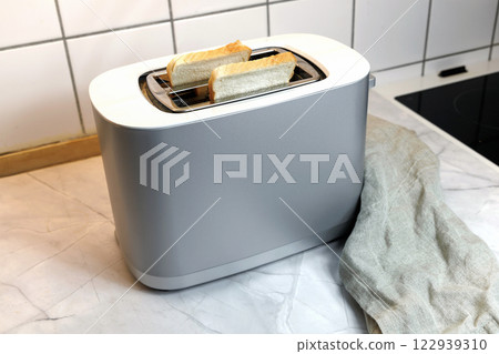 Toaster with two pieces of toast bread Toaster with two pieces of toast bread 122939310