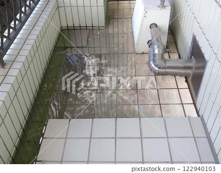 Balcony drain clogged with garbage, like a swimming pool, dangerous Balcony drain clogged with garbage, like a swimming pool, dangerous 122940103