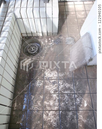 Balcony drain clogged with garbage after cleaning 122940105
