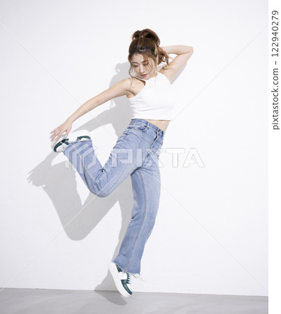 Cute woman dancing 122940279