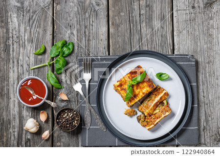 Moussaka, greek beef and eggplant dish, top view Moussaka, greek beef and eggplant dish, top view 122940864
