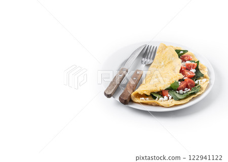 Stuffed omelette with tomatoes and spinach isolated on white background Stuffed omelette with tomatoes and spinach isolated on white background 122941122