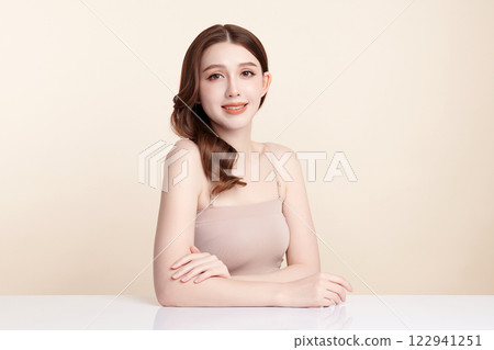Beautiful young asian woman with clean fresh skin on beige background, Face care, Facial treatment, Cosmetology, beauty and spa, Asian women portrait. 122941251