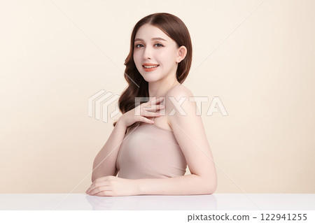 Beautiful young asian woman with clean fresh skin on beige background, Face care, Facial treatment, Cosmetology, beauty and spa, Asian women portrait. Beautiful young asian woman with clean fresh skin on beige background, Face care, Facial treatment, Cosmetology, beauty and spa, Asian women portrait. 122941255