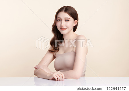 Beautiful young asian woman with clean fresh skin on beige background, Face care, Facial treatment, Cosmetology, beauty and spa, Asian women portrait. 122941257