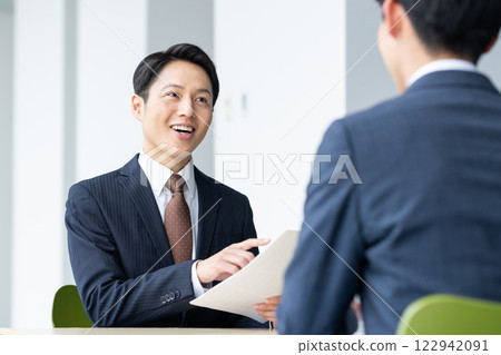 Businessmen making adjustments in the office. Photo courtesy of Sky Perfect Tokyo Media Center. Businessmen making adjustments in the office. Photo courtesy of Sky Perfect Tokyo Media Center. 122942091