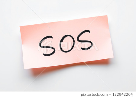 Text SOS on pink note 122942204