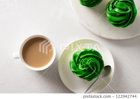Patrick's Day homemade cupcakes with green whipped cream on white background. View from above. Copy space. 122942744