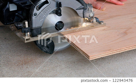 Dangerous power saw with the blade extended too far Dangerous power saw with the blade extended too far 122943476