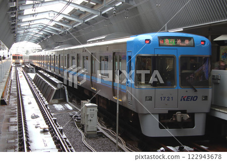 Keio Inokashira Line 1000 series train parked at Kichijoji Station where snow still remains Keio Inokashira Line 1000 series train parked at Kichijoji Station where snow still remains 122943678