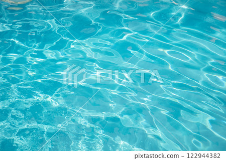 Clear, transparent turquoise water on the swimming pool background 122944382
