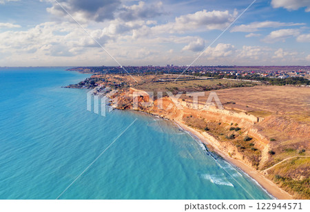 Seascape with sea and city on the clay steep coast. Aerial view towards Fontanka, Odesa, Ukraine 122944571
