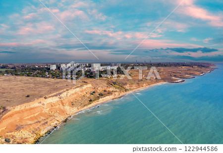 Seascape with sea and city on the clay steep coast. Aerial view of Chornomorske, Odesa, Ukraine 122944586