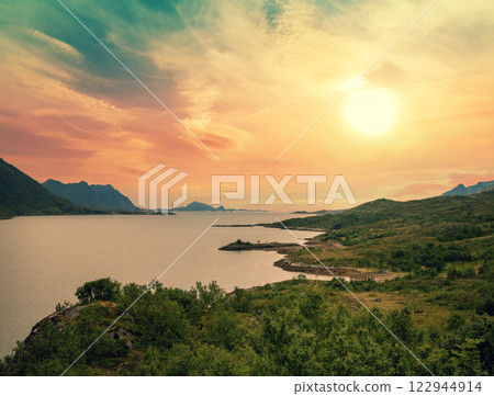 Mountain coast in the evening. View of the fjord during sunset. The beautiful nature of Norway 122944914