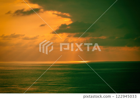 Seascape in the evening, beautiful golden sunset over calm sea. Nature landscape 122945033