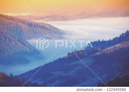 Beautiful mountains during sunset. Mountains above the clouds. Carpathian Mountains, Ukraine Beautiful mountains during sunset. Mountains above the clouds. Carpathian Mountains, Ukraine 122945080