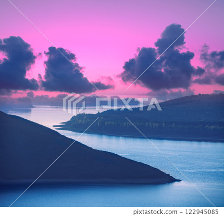 Beautiful evening landscape. River with rocky hills at Beautiful evening landscape. River with rocky hills at sunset in autumn. Beautiful nature sunset. Beautiful nature 122945085