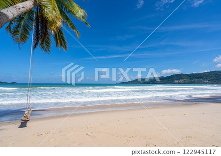 Empty tropical beach and seascape, Beautiful sandy beach and sea in sunny day,Blue sky in good weather day, Beach sea space area nature background 122945117