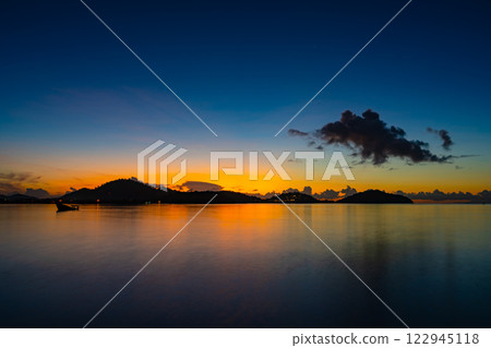 Landscape of colorful clouds in sunset or sunrise sky over sea with reflection in the tropical sea,Beautiful seascape scenery,Amazing light of nature Landscape nature background 122945118