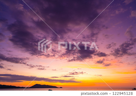 Landscape of colorful clouds in sunset or sunrise sky over sea with reflection in the tropical sea,Beautiful seascape scenery,Amazing light of nature Landscape nature background Landscape of colorful clouds in sunset or sunrise sky over sea with reflection in the tropical sea,Beautiful seascape scenery,Amazing light of nature Landscape nature background 122945128