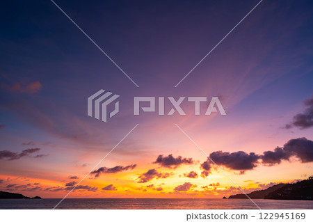 Amazing colorful clouds in sunset or sunrise sky over sea nature landscape background 122945169