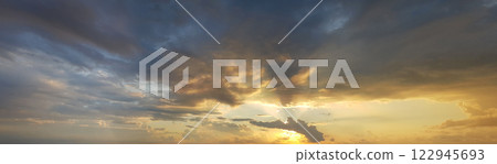 Sunrise sky background. Colourful gold sky with clouds and sun light 122945693