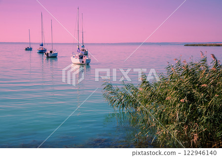 Sailing boats in the lake during sunset. Balaton Lake Hungary Europe 122946140