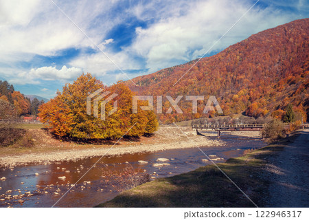 Mountain river with a rocky shore. Beautiful natural landscape Mountain river with a rocky shore. Beautiful natural landscape 122946317