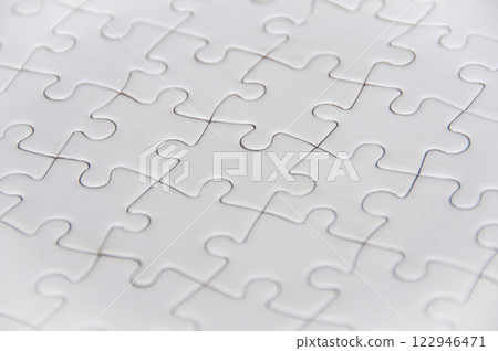 Side view of white jigsaw puzzle 122946471