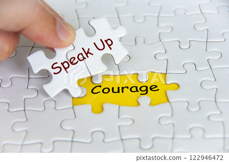 Speak Up and Courage text on jigsaw puzzle. Cultivating Speak Up Culture concept Speak Up and Courage text on jigsaw puzzle. Cultivating Speak Up Culture concept 122946472