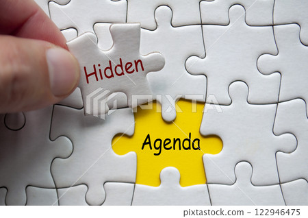 Hidden Agenda text on jigsaw puzzle. Unknown motif concept 122946475